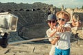 Mother with son take a vacation photo on the Side ampitheatre view. Traveling with kids concept image Royalty Free Stock Photo