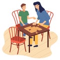 Mother and son together at home playing table logic game, connecting collecting puzzle pieces Royalty Free Stock Photo