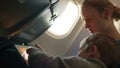 Mother and son with touchpad in the plane