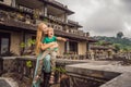 Mother and son tourists in abandoned and mysterious hotel in Bedugul. Indonesia, Bali Island. Bali Travel Concept