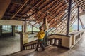 Mother and son tourists in abandoned and mysterious hotel in Bedugul. Indonesia, Bali Island. Bali Travel Concept