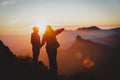 Mother and son travel in mountains at sunset, family hiking in nature Royalty Free Stock Photo