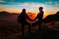 Mother and son travel in mountains at sunset, family hiking in nature Royalty Free Stock Photo