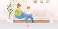 Mother with son using laptops happy family spending time together modern living room interior Royalty Free Stock Photo