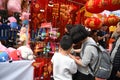 A mother and a son is visiting the Chinese new year market