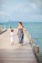 Mother and son walking along jetty Royalty Free Stock Photo