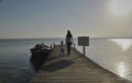 Mother and son walking along the jetty Royalty Free Stock Photo