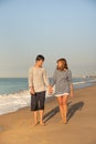 Mother and son walking and enjoying the beach Royalty Free Stock Photo
