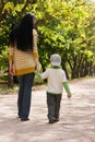 Mother and son walking in park Royalty Free Stock Photo