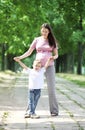 Mother and Son Walking in the Park Royalty Free Stock Photo
