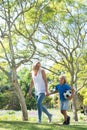 Mother and son walking in the park with football Royalty Free Stock Photo