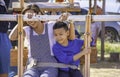 Mother and son on wooden Ferris wheel and bright blue sky at Windtime Khao kho , Phetchabun in Thailand Royalty Free Stock Photo