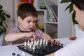 Mother and son of 4 years playing chess. Development for preschoolers, learning board games Royalty Free Stock Photo