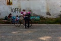 Mother and sons get ready to ride a bike, Milan Royalty Free Stock Photo