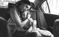 Mother Soothe Her Son Crying in the Car Royalty Free Stock Photo