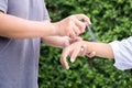 Mother spraying insect repellents on her son arm Royalty Free Stock Photo