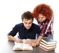 Mother standing near son's desk helping him doing his homework