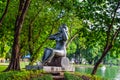 Mother stone Statue carrying baby in park at Bangkok, Thailand Royalty Free Stock Photo