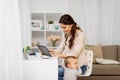 Mother student with baby and tablet pc at home Royalty Free Stock Photo