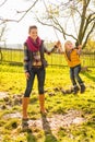 Mother swinging child outdoors Royalty Free Stock Photo