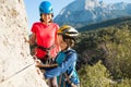 A woman instructs how to use a carabiner for belaying Royalty Free Stock Photo