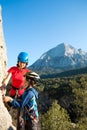 A woman instructs how to use a carabiner for belaying Royalty Free Stock Photo