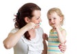 Mother teaches her daughter kid teeth brushing