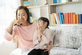 Mother teaches her daughter to brush her teeth Royalty Free Stock Photo