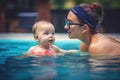 Mother teaching baby swimming pool