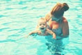 Mother teaching baby swimming pool Royalty Free Stock Photo