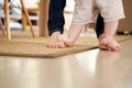 Mother teaching baby to walk indoors Royalty Free Stock Photo