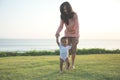 Mother teaching baby to walk Royalty Free Stock Photo