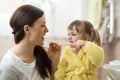 Mother teaching daughter child teeth brushing in bathroom Royalty Free Stock Photo