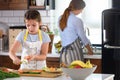 Mother Teaching Child to Cook and Help in the Kitchen Royalty Free Stock Photo