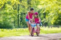 Mother teaching child to ride a bike Royalty Free Stock Photo