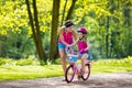 Mother teaching child to ride a bike Royalty Free Stock Photo