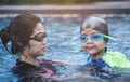 Mother teaching her son to swim Royalty Free Stock Photo