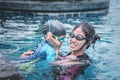 Mother teaching her son to swim Royalty Free Stock Photo