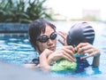 Mother teaching son to swim Royalty Free Stock Photo