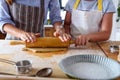 Mother making apple pie with children at home kitchen Royalty Free Stock Photo