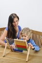 Mother teaching son Royalty Free Stock Photo