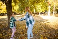 Mother and teen daughter quarreling in park. Mother criticizing her disobedient child for bad behavior. Children upbringing Royalty Free Stock Photo