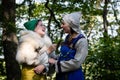 Mother and teenage daughter communicate and laugh. woman and girl in antique viking clothes.
