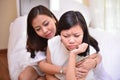 Mother and teenage daughter talking in the living room Royalty Free Stock Photo