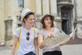 Mother with teenage daughter travel, women with map