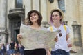 Mother with teenage daughter travel, women with map