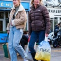 Mother And Teenage Daughter Walking Through An Outdoor Market