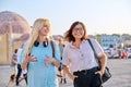 Mother and teenage daughter are walking together in the city Royalty Free Stock Photo