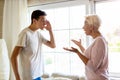 Mother and teenage son arguing at home Royalty Free Stock Photo