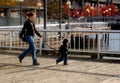 Mother and harnessed Toddler Walk